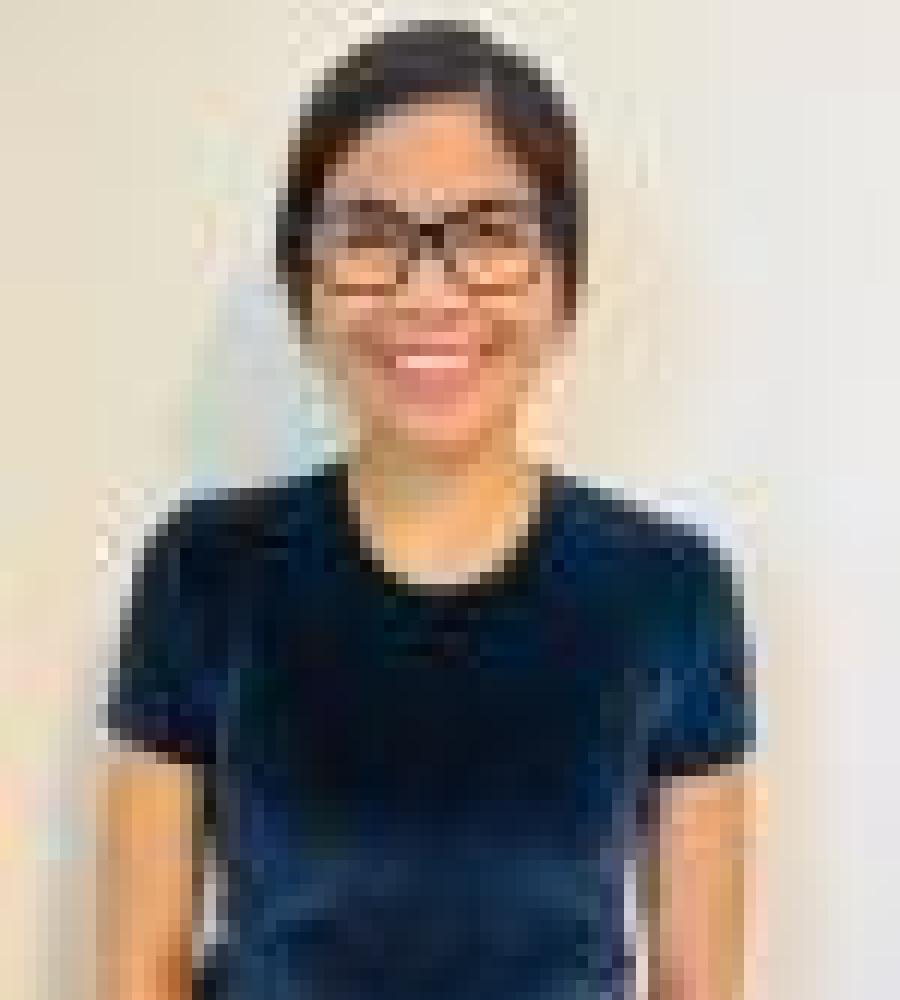 Rochelle has on a blue shirt and is smiling 
